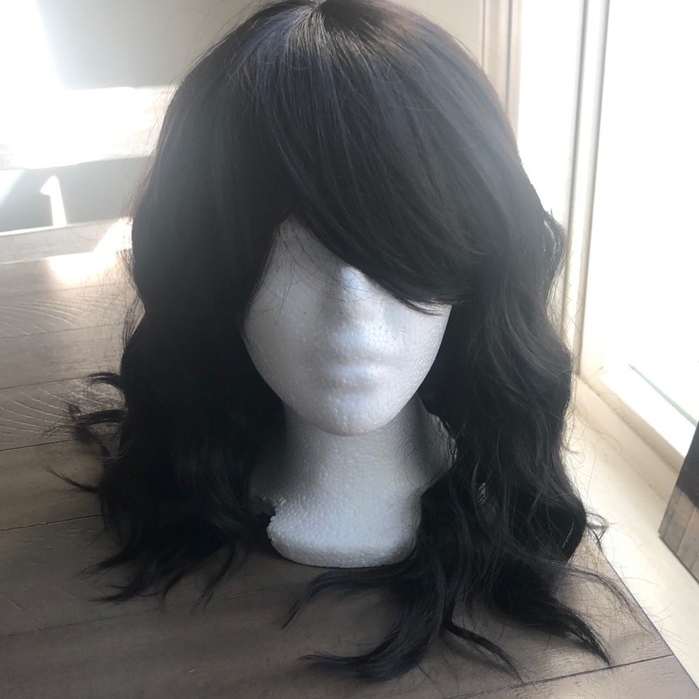Synthetic black wig with bangs wavy past shoulder length. Brand new never worn